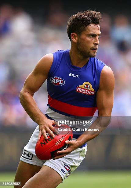 Luke Dahlhaus of the Bulldogs kicks during the 2016 NAB Challenge AFL match between the Collingwood Magpies and the Western Bulldogs at Etihad...