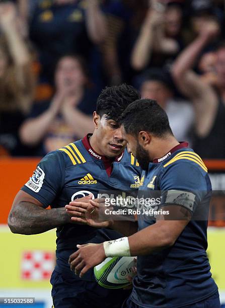 Malakai Fekitoa of the Highlanders celebrates his try with Lima Sopoaga during the round three Super Rugby match between the Highlanders and the...