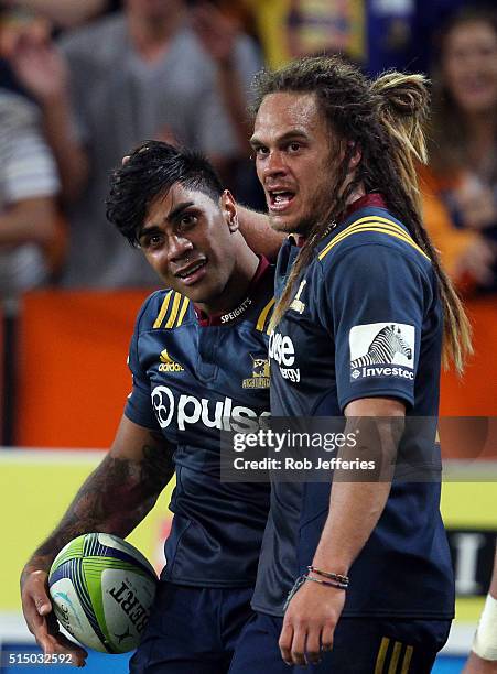 Malakai Fekitoa of the Highlanders celebrates his try with Dan Pryor during the round three Super Rugby match between the Highlanders and the Lions...