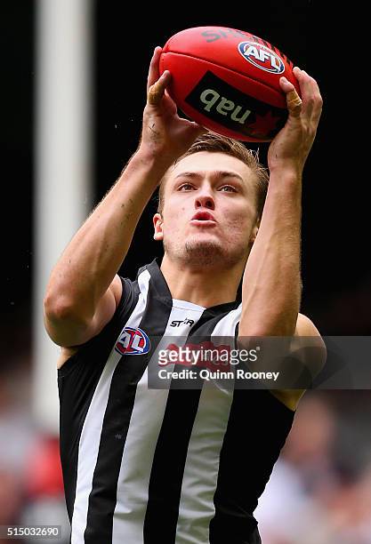 Darcy Moore of the Magpies marks during the 2016 NAB Challenge AFL match between the Collingwood Magpies and the Western Bulldogs at Etihad Stadium...