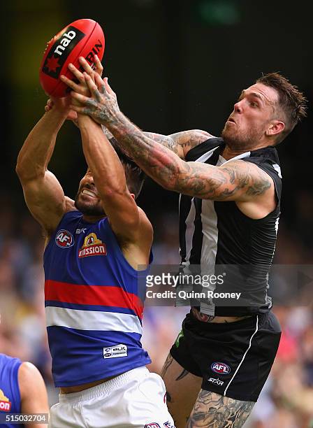 Marcus Adams of the Bulldogs and Dane Swan of the Magpies compete for a mark during the 2016 NAB Challenge AFL match between the Collingwood Magpies...