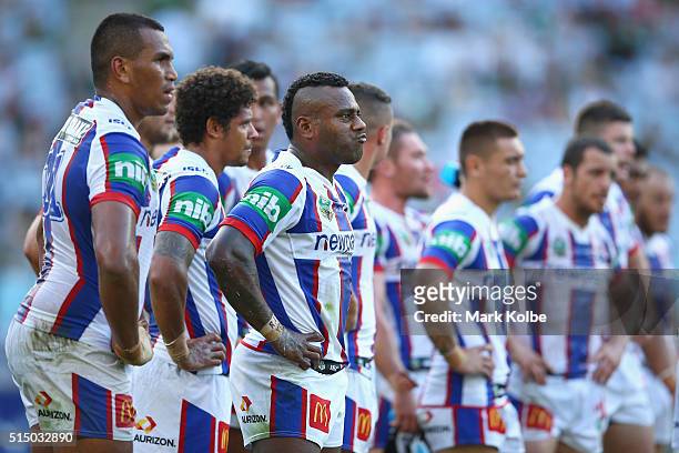 Akuila Uate of the Knights and his team mates look dejected after a Rabbitohs try during the round two NRL match between the South Sydney Rabbitohs...