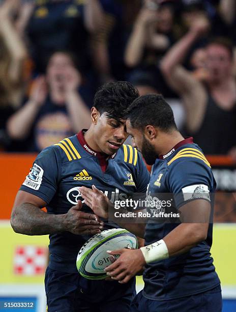 Malakai Fekitoa of the Highlanders celebrates his try with Lima Sopoaga during the round three Super Rugby match between the Highlanders and the...