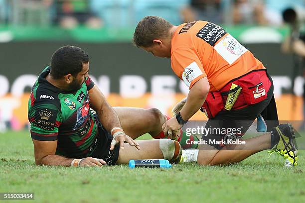 Greg Inglis of the Rabbitohs receieves attention from the trainer during the round two NRL match between the South Sydney Rabbitohs and the Newcastle...