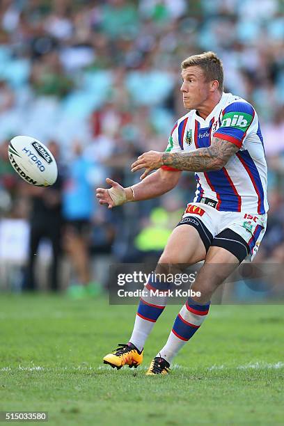 Trent Hodkinson of the Knights passes during the round two NRL match between the South Sydney Rabbitohs and the Newcastle Knights at ANZ Stadium on...