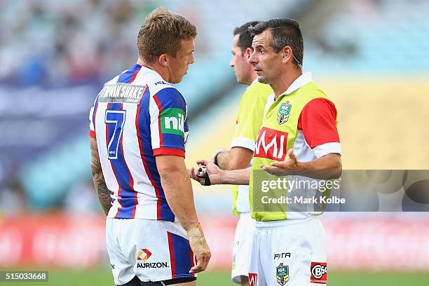 Trent Hodkinson of the Knights speaks to the referee Gavin Badger during the round two NRL match between the South Sydney Rabbitohs and the Newcastle...