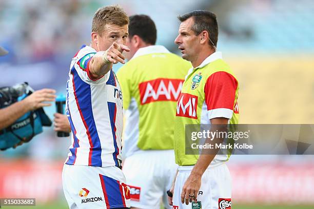 Trent Hodkinson of the Knights speaks to the referee Gavin Badger during the round two NRL match between the South Sydney Rabbitohs and the Newcastle...