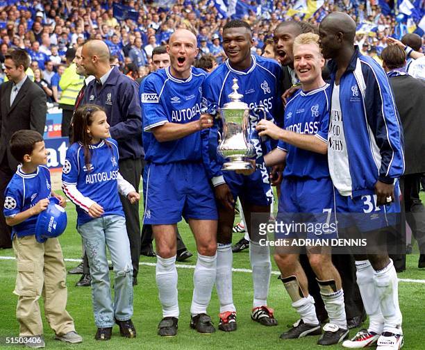 Chelsea's French players Franck Leboeuf , Marcel Desailly Didier Deschamps and Liberian George Weah celebrate with some of the players' children...