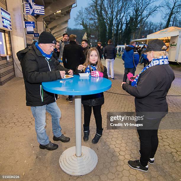 Supporters of De Graafschap eating snacks and boerenkool before the match during the Dutch Eredivisie match between De Graafschap and Roda JC...