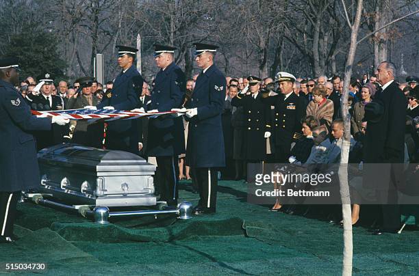 Some of the original seven astronauts walk as honorary pallbeares beside the caisson bearing the remains of astronaut Virgil I. Grissom at Arlington...