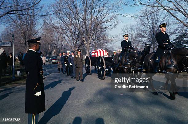 Some of the original seven astronauts walk as honorary pallbearers beside the caisson bearing the remains of astronaut Virgil I. Grissom at Arlington...