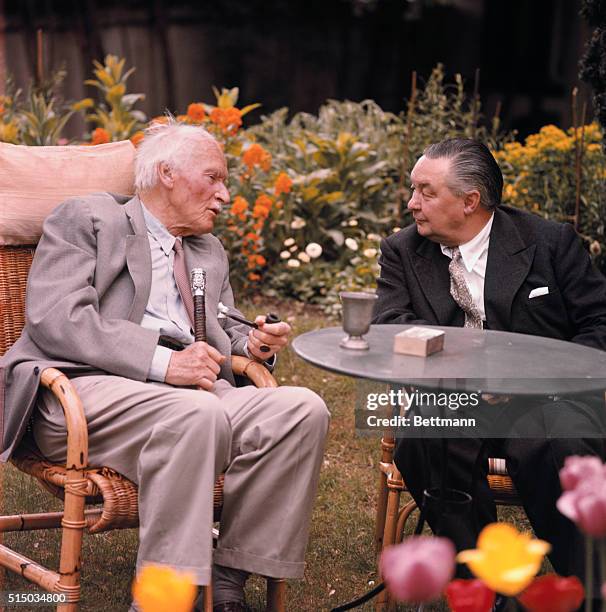 Kusnacht, Switzerland: Psychologist Carl G. Jung chats with Gordon Young at his villa.