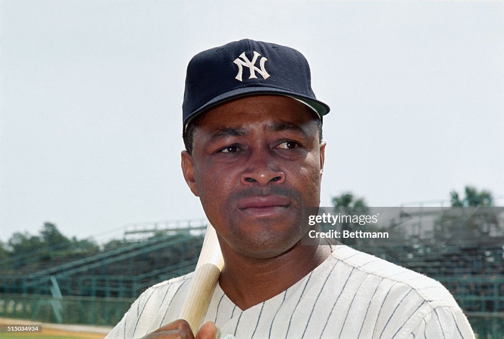 Portrait of Elston Howard Posing in Uniform and Holding Baseball Bat