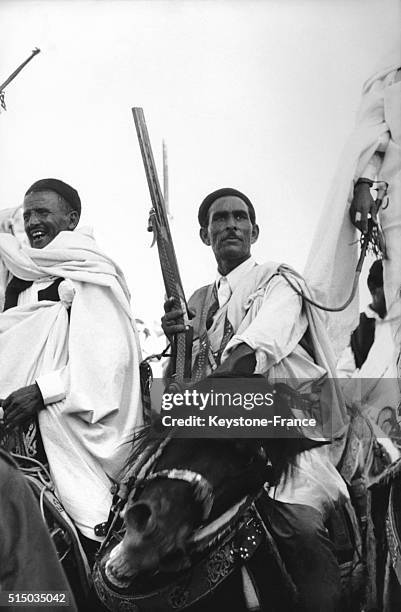 Bedouins taking part at a festival celebrating the beginning of production in new parts of the Marsa El Brega petrochemical centre in Libya - The...