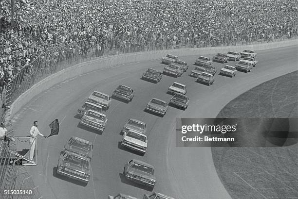 Fifty daredevils drivers in late model stock cars get the crew flag indicating the start of the "Daytona 500" a grueling 500-mile test of man and...