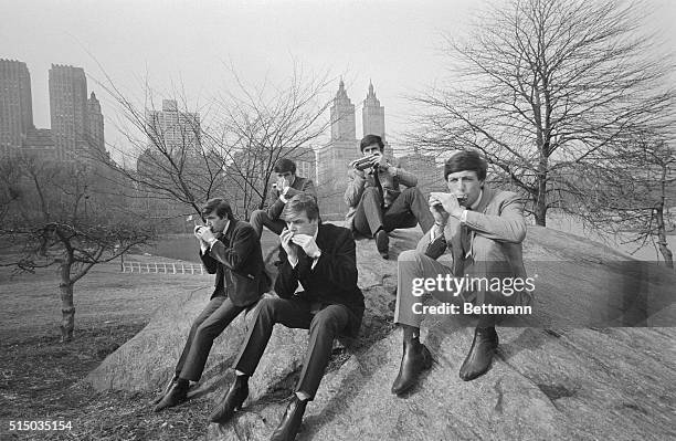 The Dave Clark Five, the latest British rock'n-rollers to visit these shores, demonstrate their joy at the spring like weather in Central Park in...