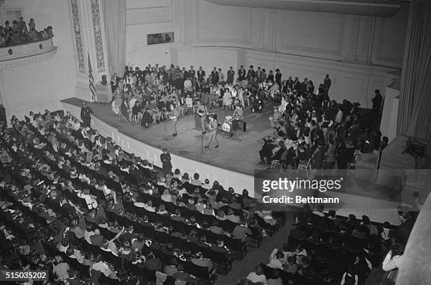 Traditionally staid Carnegie Hall appears to be bursting at the seams here, as the Beatles, the British rock 'n roll quartet, takes a stage that's...