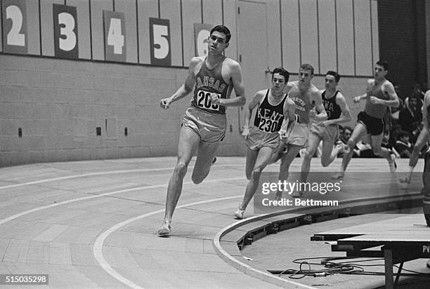 Leading all the way, Jim Ryun of Kansas romps toward a new NCAA indoor record in the mile run at Detroit's Cobo Hall 3/11. Ryun left the field far...