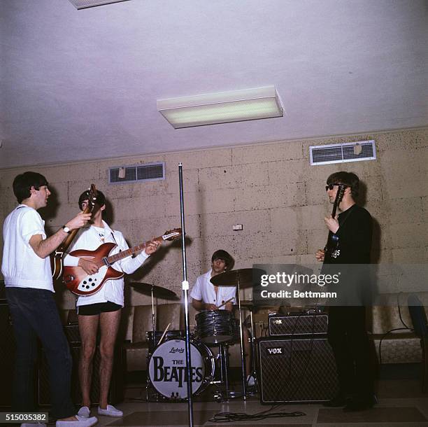 England's rock and roll quartet, The Beatles, rehearse for their second appearance on the Ed Sullivan TV show. Left to right: John Lennon, Paul...