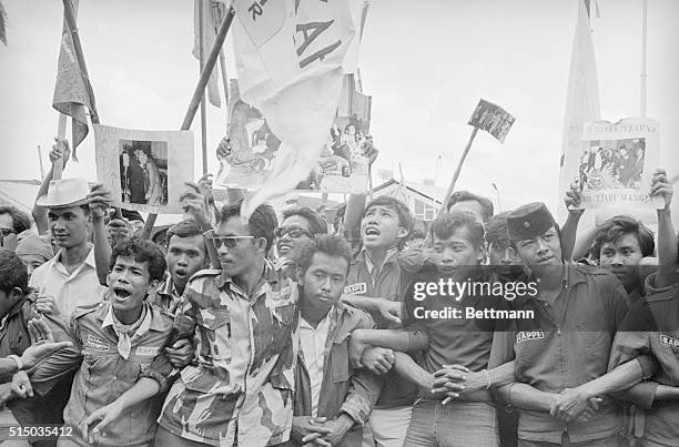 Djakarta: Demand Sukarno Be "Branded." Indonesian students chant anti-Sukarno slogans during their demonstration in Djakarta, Jan. 30th. Some 40 who...