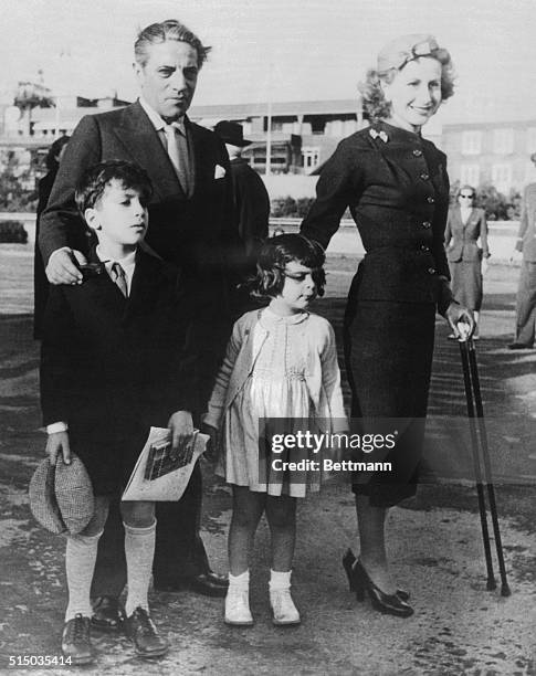 Greek shipping magnate Aristotle Onassis is shown with his wife Tina and their children Alexander and Christina at the launching of one of his new...