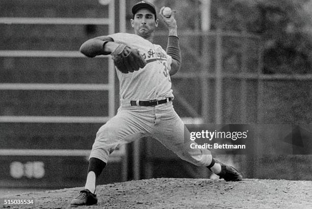 Dodger pitcher Sandy Koufax registers his best determined look 8/4 as he adds more luster to his status as the top pitcher in the majors. But the...