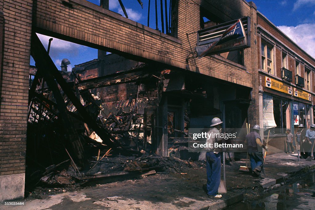 Detroit 75 Riots In this photo, helmeted Negro workers shovel and sweep away the... News ...