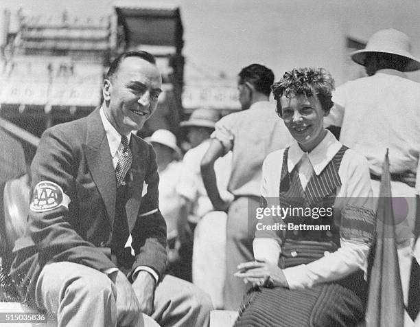 Rickenbacker Writes It All Down. Another "Air-Man" Amelia Earhart visits with Rickenbacker at the Indianapolis Speedway.