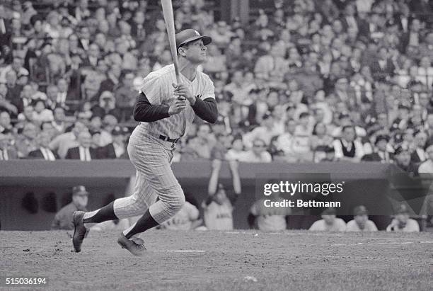 New York Yankee's Mickey Mantle slams a three-run homer in the bottom of the tenth inning here to give the Yanks a 4-1 victory over the California...