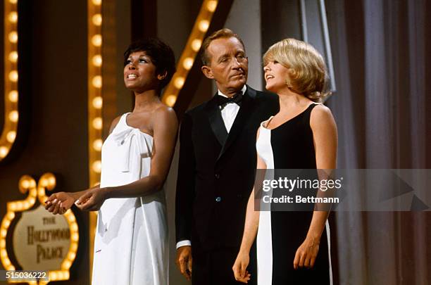 Singing together during taping of the television show Hollywood Palace are Bing Crosby, Diahann Carroll and Joey Heatherton .