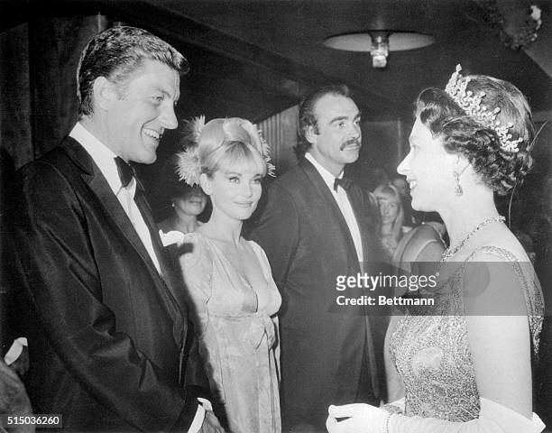 Britain's Queen Elizabeth II meets some of the current "royalty" of the movies in London. Exchanging greetings with the Queen are Dick Van Dyke,...