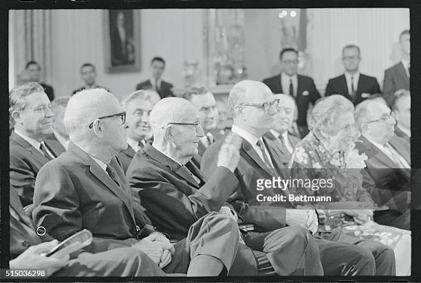 President Johnson has a hardy handshake for Senator Carl Hayden , at a ceremony in the East Room of the White House today at which the Chief...
