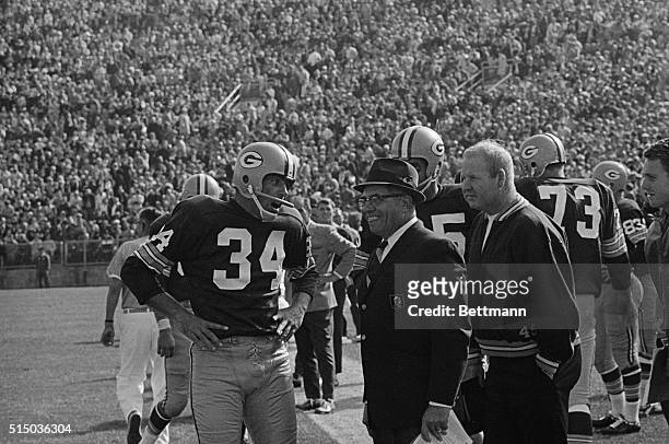 Green Bay Packer kicker Don Chandler talks to a happy coach Vince Lombardi after kicking a 46 yard field goal to beat the Chicago Bears 13-10.