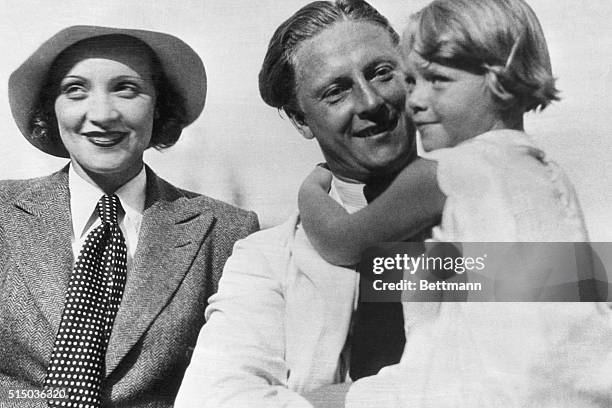 Great Performers of our time: Marlene Dietrich. Mr and Mrs. Rudolph Sieber and their daughter, Maria, circa 1931. Dietrich is wearing the mannish...