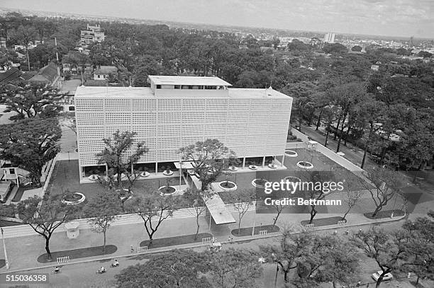 This aerial view of the new U.S. Embassy in Saigon shows the helicopter landing pad on the roof. There is a 10 foot wall around the building.