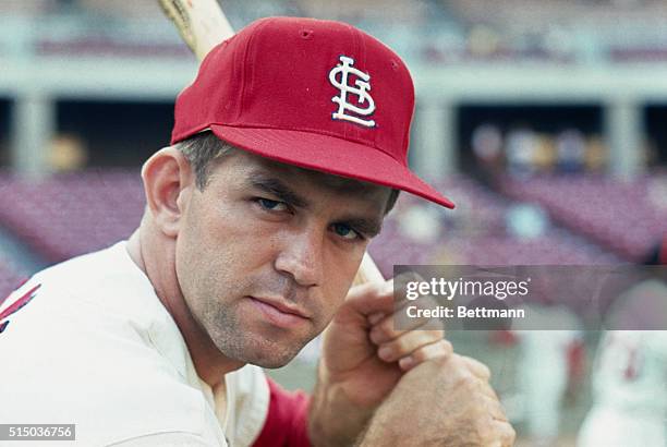 St. Louis Cardinals catcher, Tim McCarver clutches his bat, August 1967. McCarver is hitting 308 and is having one of his best years with the team....