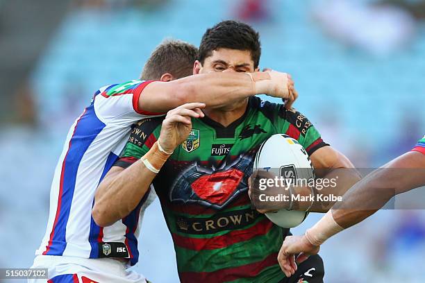 Kyle Turner of the Rabbitohs is tackled during the round two NRL match between the South Sydney Rabbitohs and the Newcastle Knights at ANZ Stadium on...