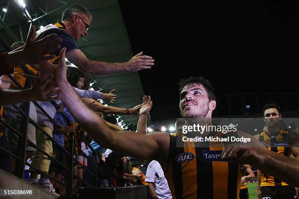 Isaac Smith of the Hawks celebrates the win with fans during the NAB CHallenge AFL match between the Hawthorn Hawks and the North Melbourne Kangaroos...