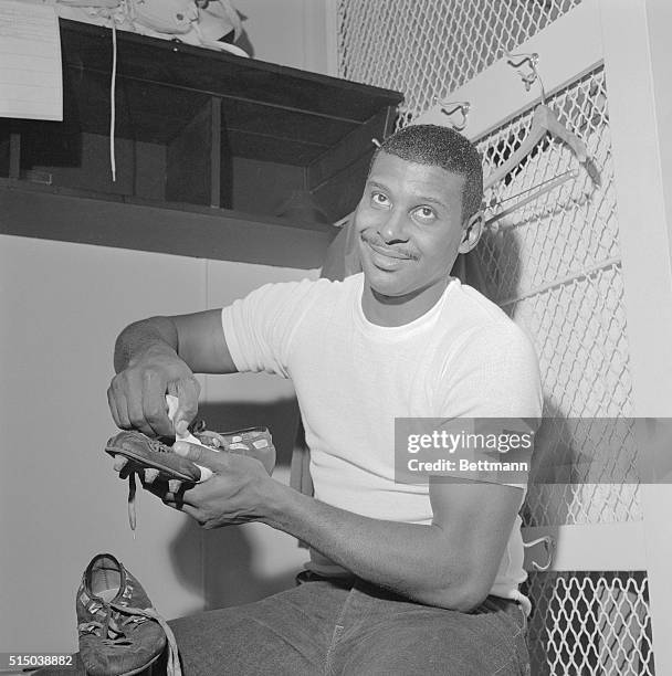 Homer Jones, "bomb-catching" split end of the New York Giants, tapes his TD-scoring cleats for the big game with the Cleveland Browns on December...