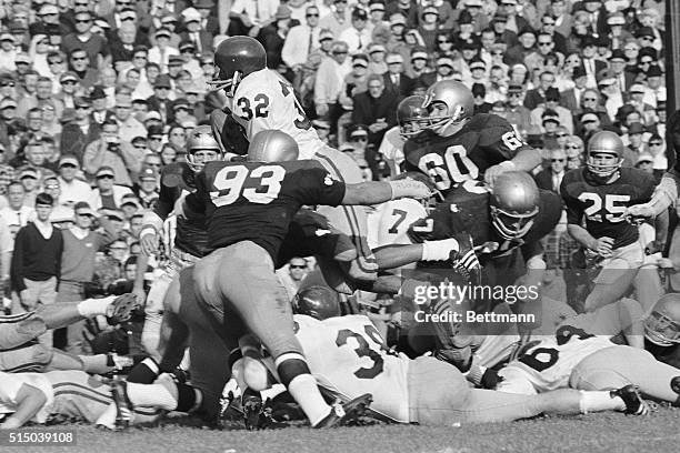 S halfback O. J. Simpson dives over the center of the Notre Dame line and scores during the fourth quarter. Simpson scored from the 3-yrad line....