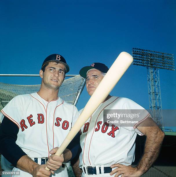 Red Sox coach Bobby Doerr, right, gives advice to outfielder Carl Yastrzemski, October 3rd, day before the World Series opener. Doerr, a former Red...