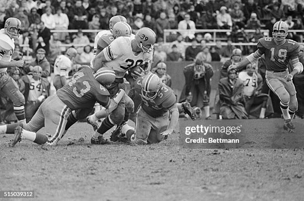 Pitt-Syracuse's Larry Csonka drives through the Pitt line for a gain of 8-yards in second quarter of game here November 4. Pitt's Ed Gallin, #43, and...