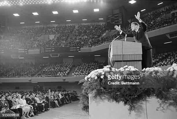 Waving his hands emphatically, American evangelist Billy Graham speaks to a near capacity audience at the Nippon Budokan Hall in Tokyo. In the first...