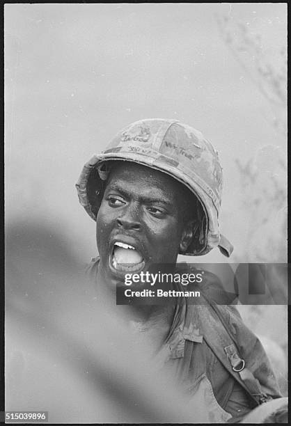 Tam Ky, South Vietnam: Just four of the infinite reactions to war can be seen on the faces of these members of Co. B, 5th Bn., 7th Regiment of the...