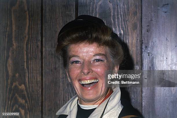 Actress Katharine Hepburn, breaking a lifetime precedent, poses for news photographers at a press conference during which she introduced her niece...