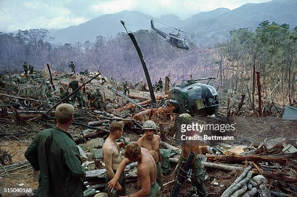 Smoke flare marks landing spot for evacuation helicopter coming in to take out U.S. 1st Cavalrymen wounded in the battle for control of the vital A...
