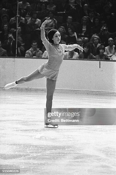 Perky Peggy Fleming of the Broadmoor Skating Club of Colorado Springs, Colorado, shows her winning form in this photo combo as she executes her...