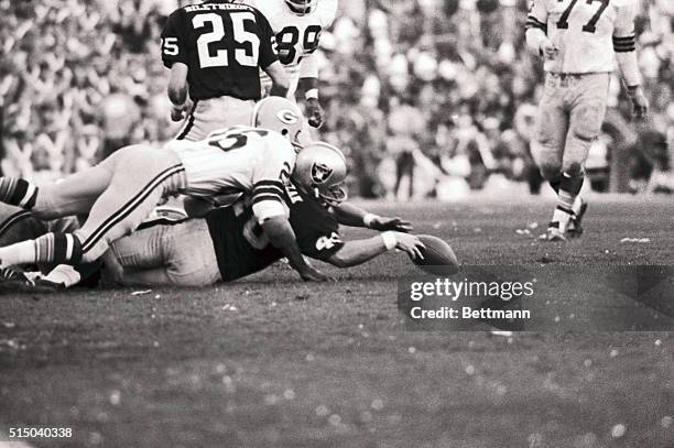 Here's the way it went for the Oakland Raiders 1/14 in their Super Bowl game with the Green Bay Packers. Here, Raider back Pete Banaszak loses the...