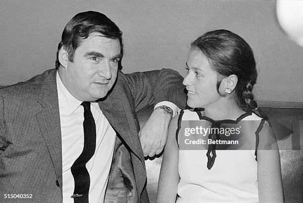 Enjoying a relaxing time together at New York's Rainbow Room are Pierre Salinger and his wife, Nicole.