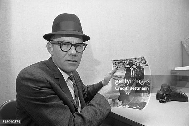 Dallas, TX- Dallas County Deputy Shiriff, Buddy Walthers, points to himself in a phone release by New Orleans District Attorney Jim Garrison....